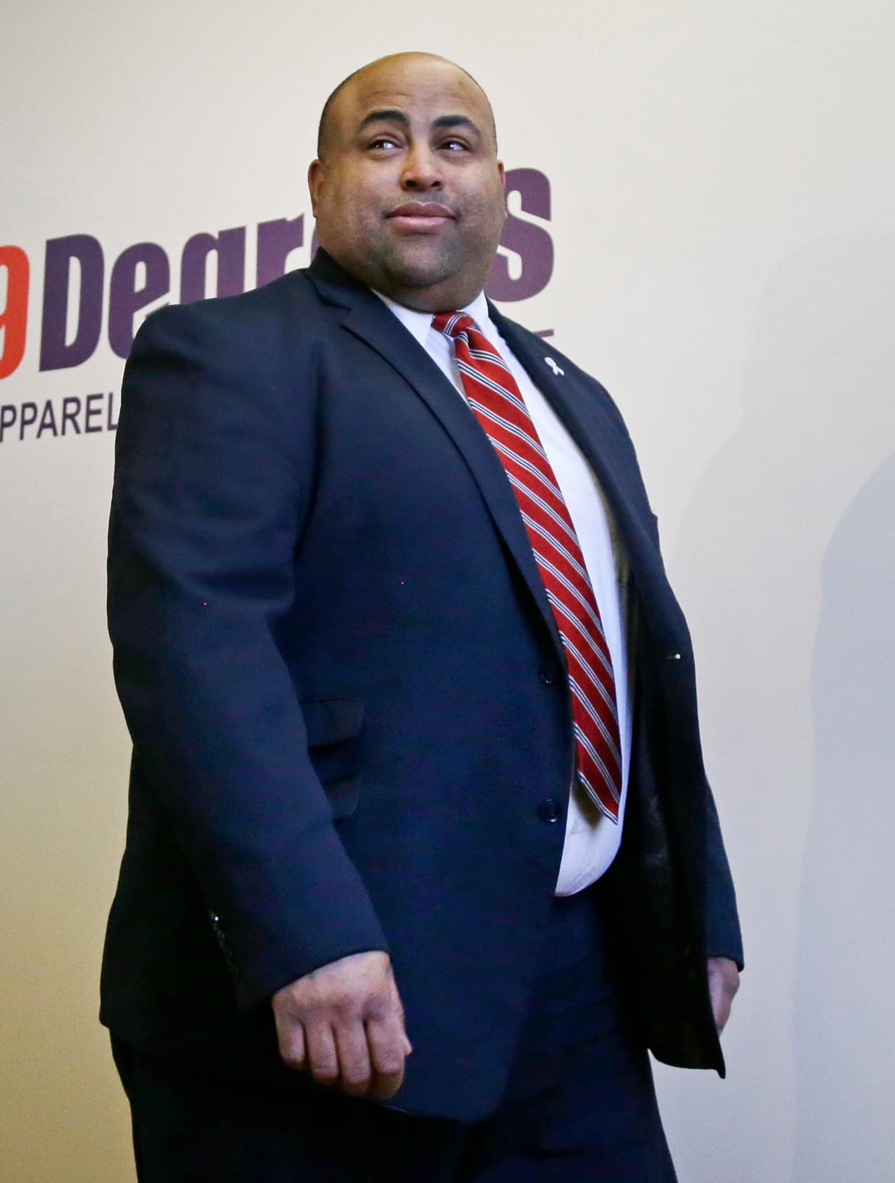 Mayor Daniel Rivera enters the room for a news conference at 99Degrees Custom, Friday, March 3, 2017, in Lawrence, Mass. (AP Photo/Elise Amendola)