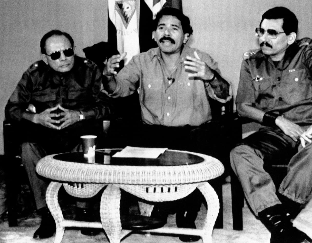 Nicaraguan President Daniel Ortega, together with Interior Minister Tomas Borge (l) and Defense Minister General Humberto Ortega (r), announcing the expulsion of 20 U.S. diplomats in retaliation for an incident at the Nicaraguan Embassy in Panama during the U.S. invasion on Panama, December 30, 1989.