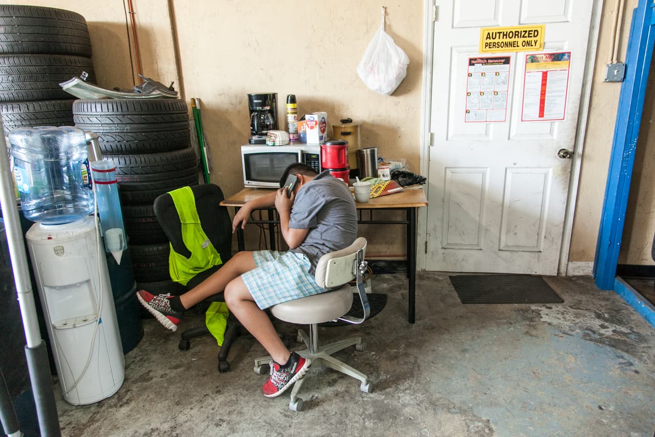 Victor calls his family every day from detention. In the picture, Jimmy talks to him from the workshop. "I love you too," he says before hanging up.