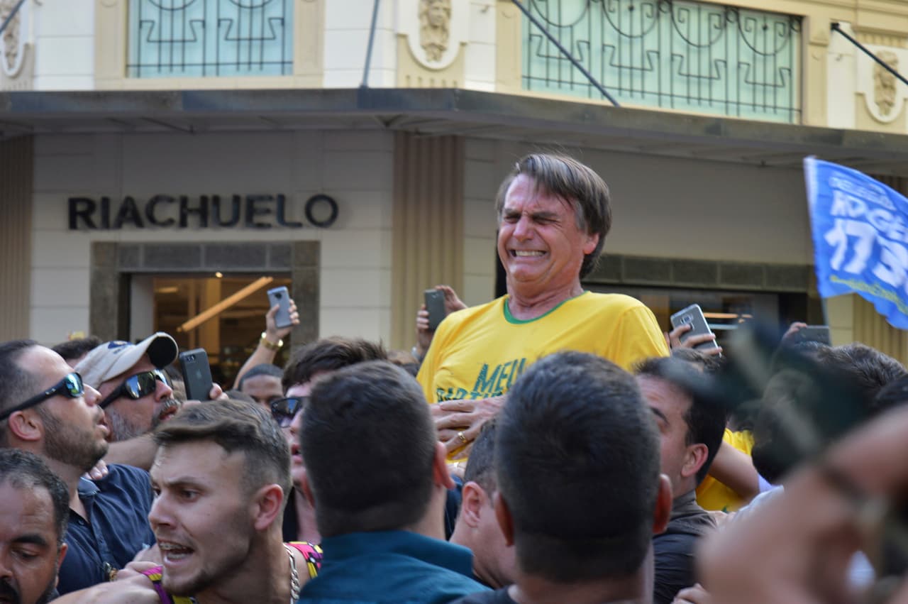 El 6 de septiembre de 2018, durante un acto político en la ciudad de Juiz de Fora, en Minas Gerais, fue apuñalado en el abdomen. El candidato es padre de Carlos Bolsonaro, concejal en el municipio de Río de Janeiro, Flávio Bolsonaro, diputado del estado de Río de Janeiro, y de Eduardo Bolsonaro, diputado federal por el estado de Sao Paulo. Todos elegidos por el PSC, partido al que todos están afiliados actualmente.
