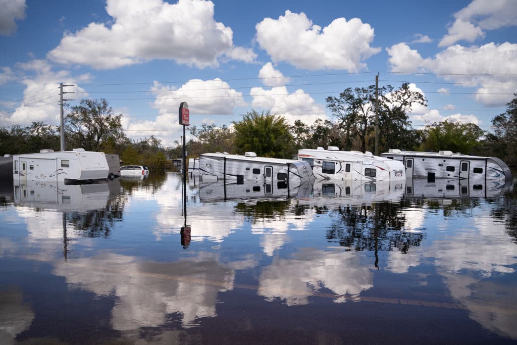 Mobile trailer homes inundated by floodwaters at the Peace River Campground on October 4, 2022 in Arcadia, Florida, almost 50 miles inland and nearly a week after Hurricane Ian made landfall on the gulf coast of Florida.