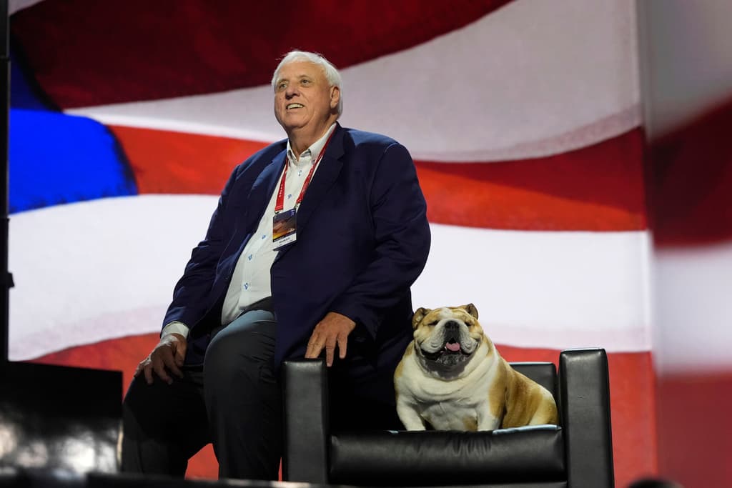 West Virginia Gov. Jim Justice checks out the stage with his dog, "Babydog," before the Republican National Convention Tuesday, July 16, 2024, in Milwaukee. (AP Photo/Jae C. Hong)