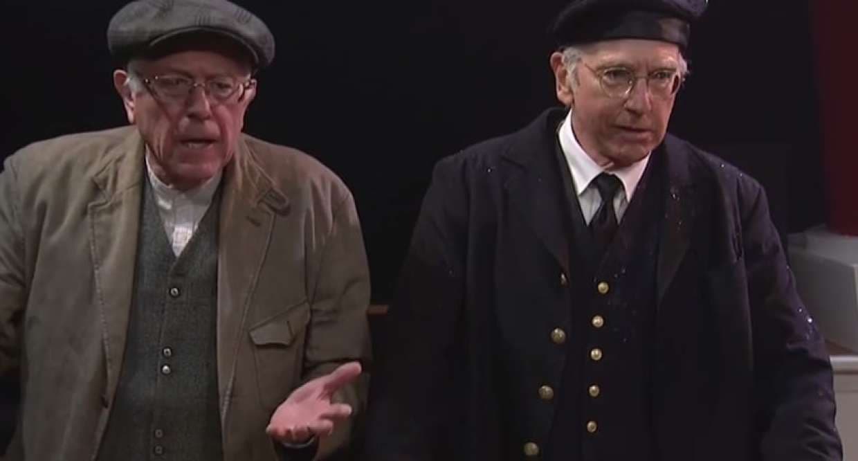 <b>Bernie habla con Bernie - </b>En febrero, 
<b><a href="http://www.univision.com/personas-bernie-sanders" target="_blank">Bernie Sanders</a></b> hizo su debut en el show 
<i>Saturday Night Live,</i> cara a cara con su "doble", el comediante y actor Larry David, cuya imitación había sido elogiada hasta por el mismo Sanders. En medio de una escenografía de la película de Titanic, Sanders apareció ayudando a poner orden entre los pasajeros a bordo del barco. David caracterizó a un pasajero disgustado por la preferencia dada a las mujeres y los niños.