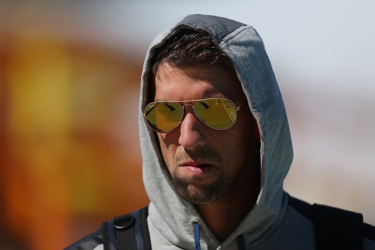 Michael Phelps vive asediado por las cámaras. Saliendo de un entrenamiento en Australia, 2014.