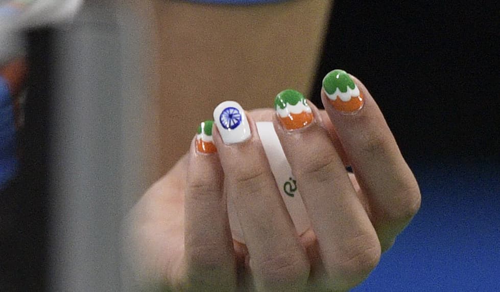 El diseño de la bandera de India en las uñas de Manika Batra quien representa a su país en el partido de tenis de mesa. 
<br>