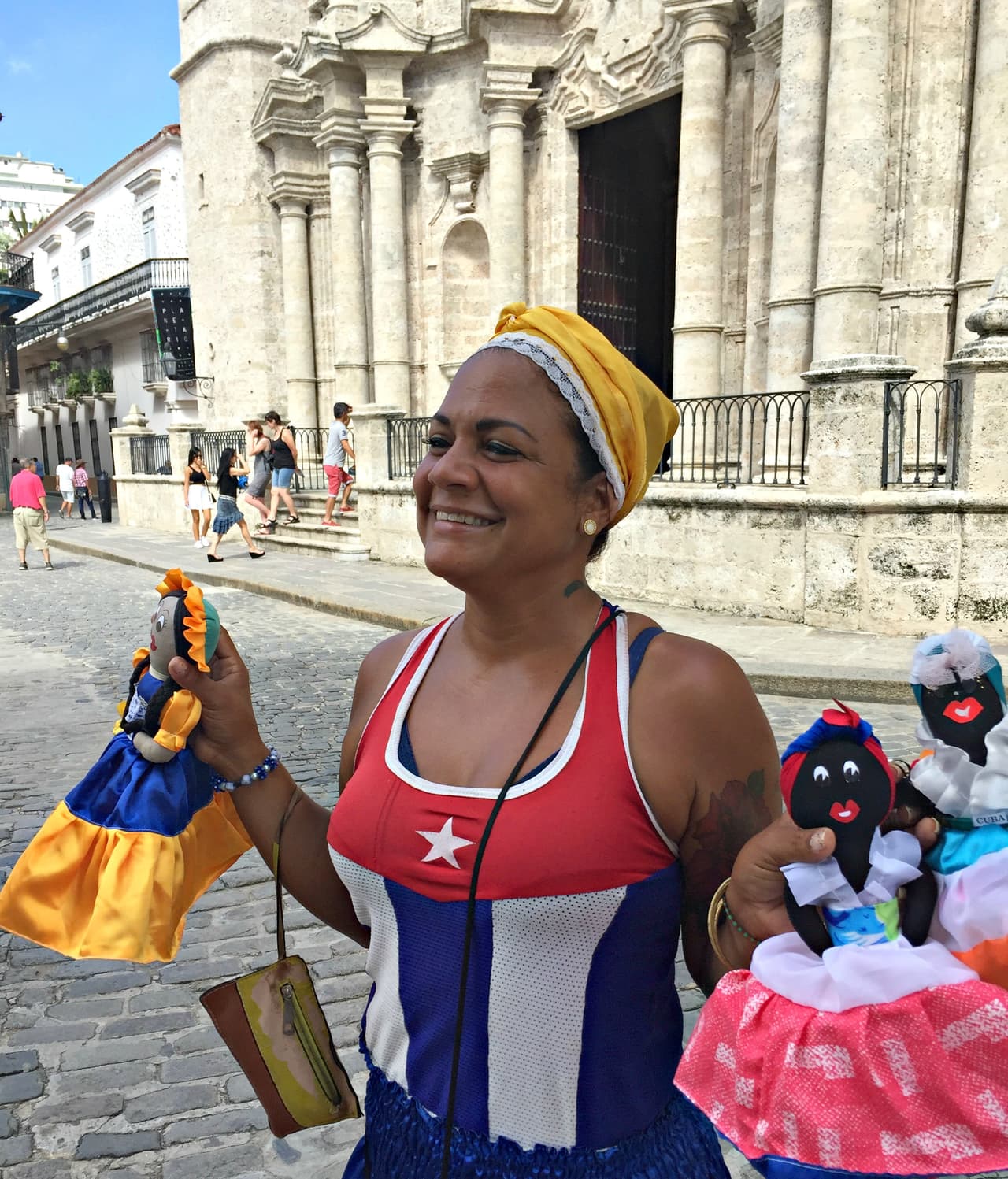Yureidys Rodriquez, 40, sells multi-racial handmade dolls to tourists in Old Havana's Cathedral Plaza
