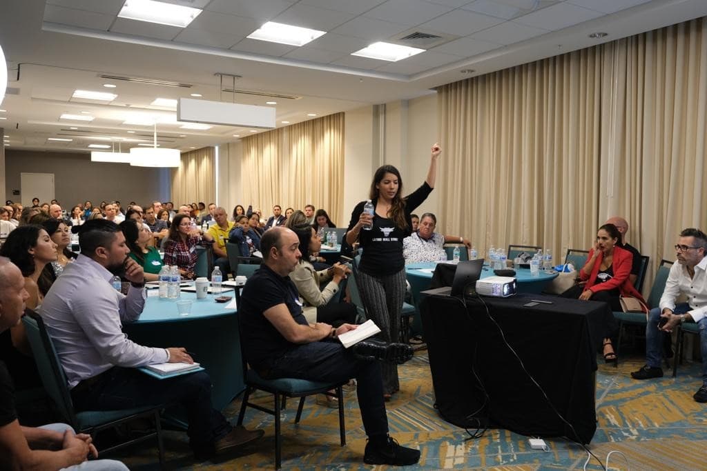 Gabriela Berrospi, founder of Latino Wall Street, giving an introductory course on stock market and options trading, Miami, October 2019.