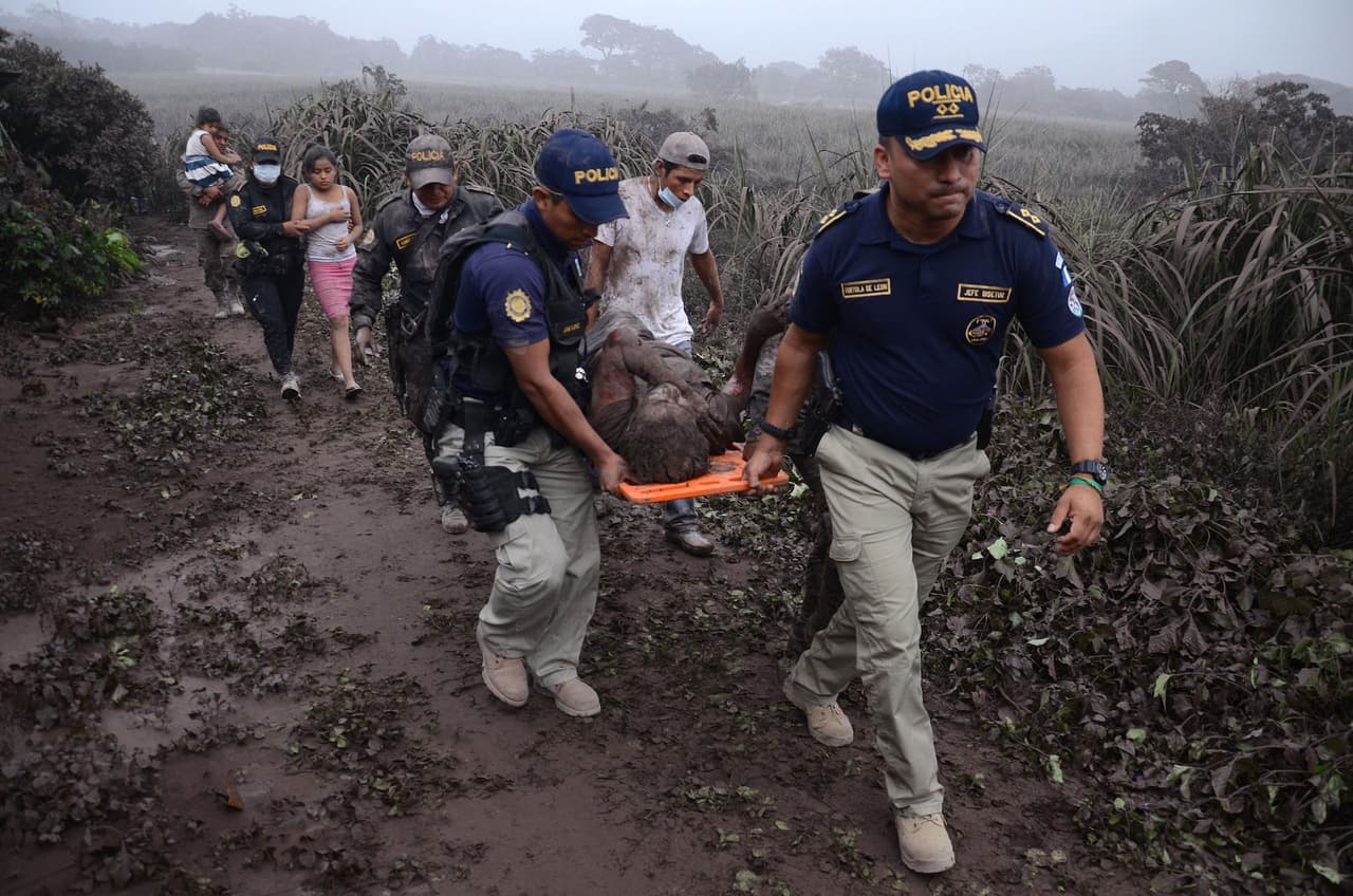 Another vicitms is carried on a stretcher by rescue workers.