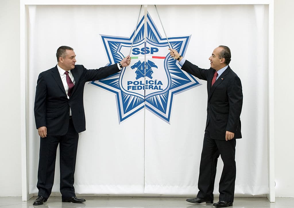 El exsecretario de Seguridad Pública Genaro García Luna (izquieda) y el expresidente mexicano Felipe Calderón.