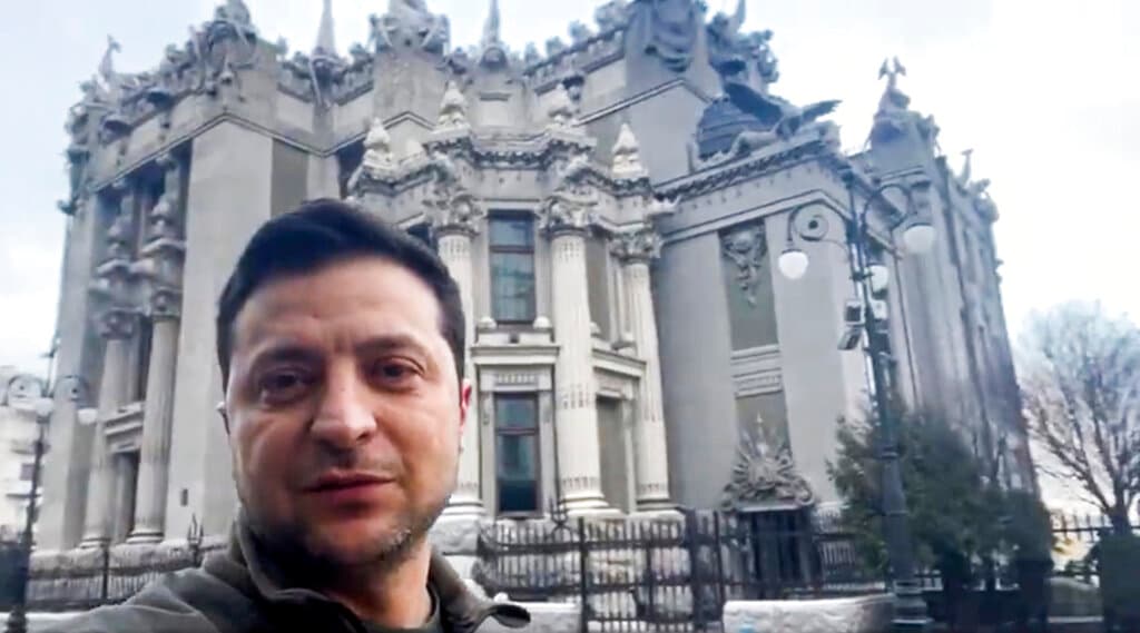 In this photo provided by the Ukrainian Presidential Press Office, Ukrainian President Volodymyr Zelenskyy speaks to the nation via his phone in the center of Kyiv, Ukraine, Saturday, Feb. 26, 2022.