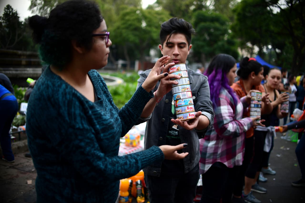 Volunteers arrange food and other donated supplies at a distribution point as the search for survivors continues in Mexico City on September 20, 2017 after a strong quake hit central Mexico on the eve. A powerful 7.1 earthquake shook Mexico City on Tuesday, causing panic among the megalopolis' 20 million inhabitants on the 32nd anniversary of a devastating 1985 quake. / AFP PHOTO / Ronaldo SCHEMIDT (Photo credit should read RONALDO SCHEMIDT/AFP/Getty Images)