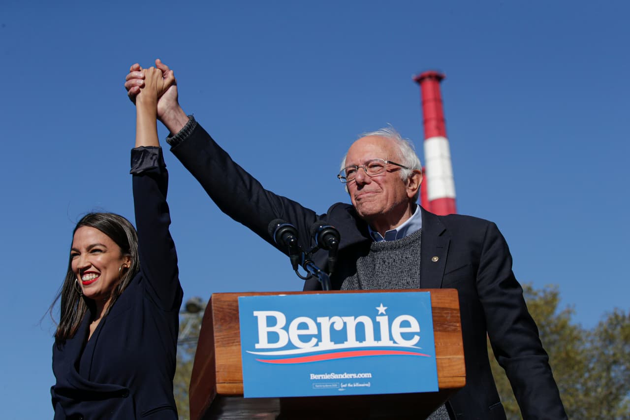 NEW YORK, NY - OCTOBER 19: Rep. Alexandria Ocasio-Cortez (D-NY) endorses Democratic presidential candidate, Sen. Bernie Sanders (I-VT) at a campaign rally in Queensbridge Park on October 19, 2019 in the Queens borough of New York City. This is Sanders' first rally since he paused his campaign for the nomination due to health problems. (Photo by Kena Betancur/Getty Images)
