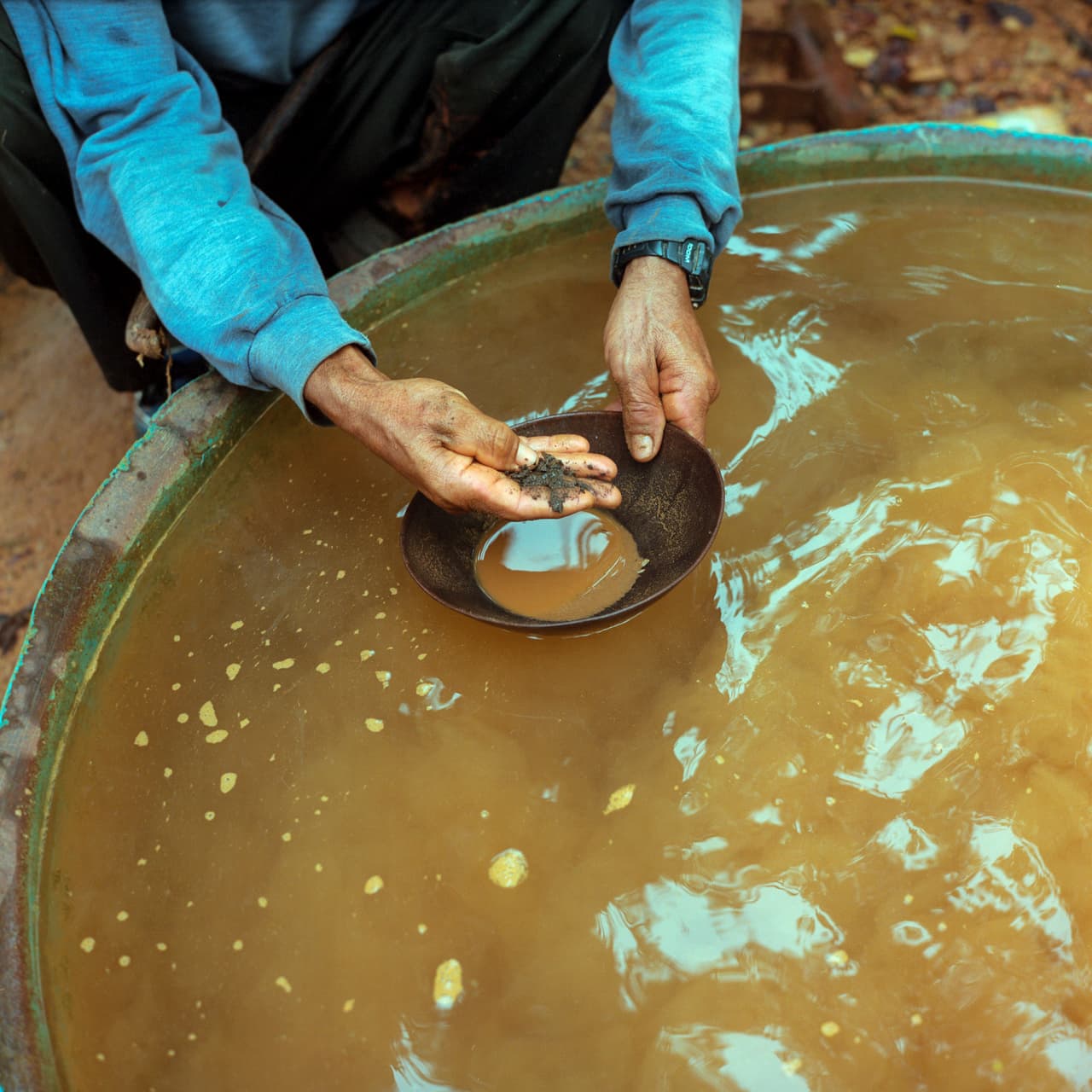 Jose Perriera Cunha, known as Perilito, shows some gold flakes in a pan. Perilito who is an equipment owner has made a good living from gold mining for decades. He's adamantly opposed to the Belo Sun Mine, worried how he will make `a living once he is pushed off his land. Jan 28, 2017.