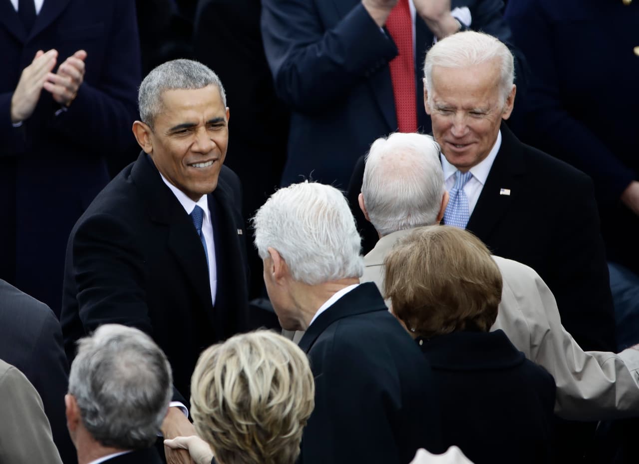 President Barack Obama greets Former President Bill Clinton before the 58th Presidential Inauguration at the U.S. Capitol in Washington, Friday, Jan. 20, 2017. Right is Vice President Joe Biden. (AP Photo/Matt Rourke)