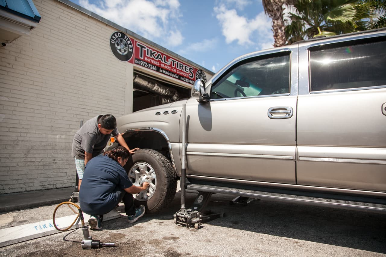 Maty's Jupiter, Florida shop is called "Tikal Tires," in reference to the Mayan ruins in their native Guatemala. The family has lived in Jupiter for a decade. They opened the shop four years ago with savings they'd earned after years of working double shifts at different jobs in the U.S.