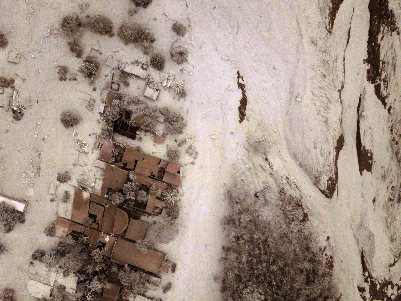 Aerial view of the hamlet of San Miguel Los Lotes, covered in the flow of lava, rock and ash from the Fuego volcano.